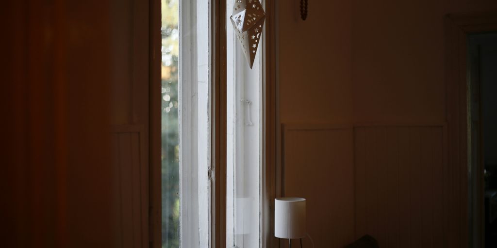 a window sill with a lamp on top of it